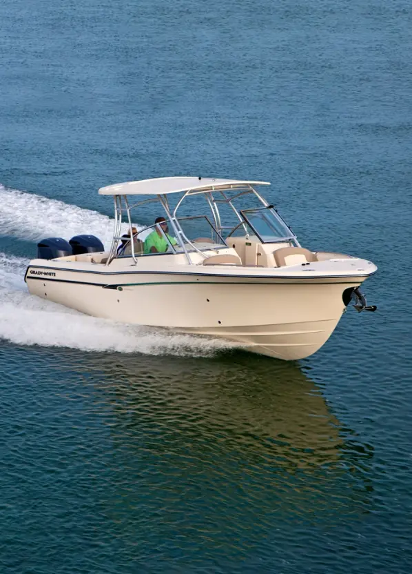 deep sea fishing charters florida - a man on a white boat sailing on calm waters