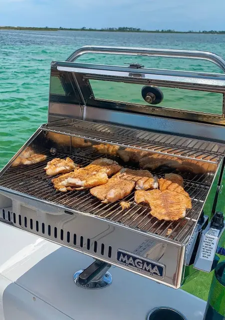 a grill with chicken on it, placed on water boat rental florida keys gallery boat image